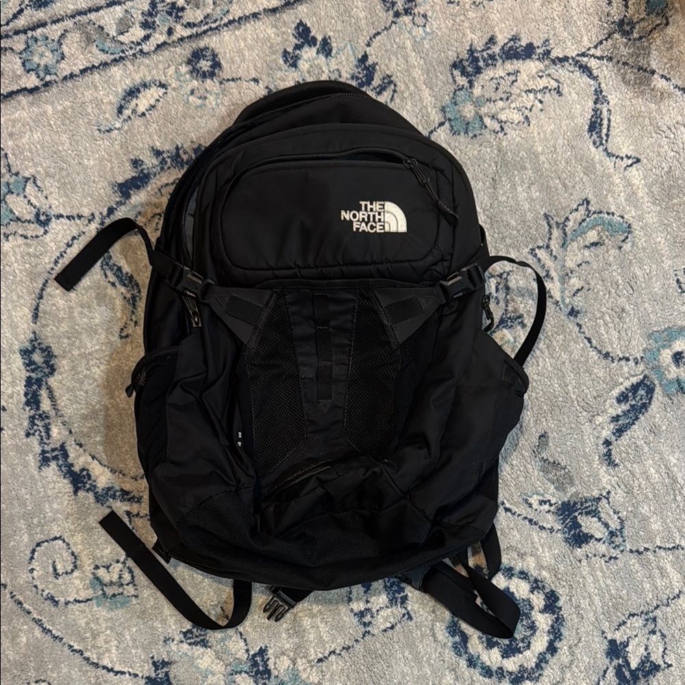 The North Face Black Backpack with Padded Straps and Durable Design